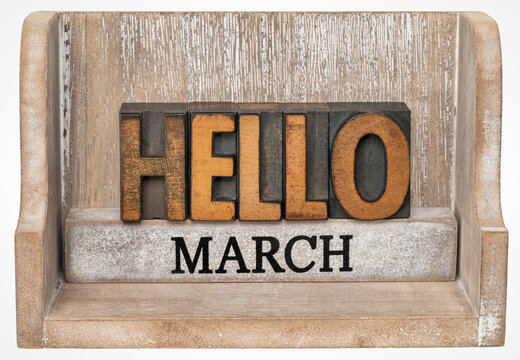 Hello March in vintage letterpress wood type inside grunge wooden box, calendar concept