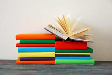 Opened Book on a pile of books