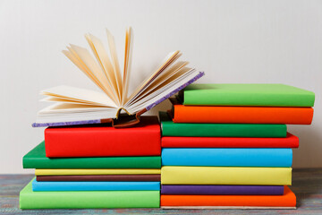 Opened Book on a pile of books