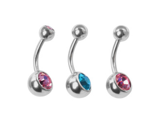 Piercing jewelry. Different belly button rings on white background, top view