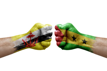 Two hands punch to each others on white background. Country flags painted fists, conflict crisis concept between brunei and sao tome and principe