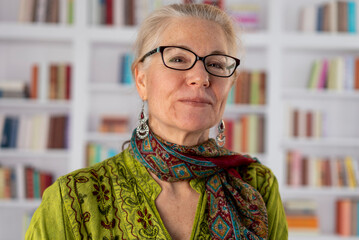 Portrait of a beautiful smiling 55 year old mature woman with grey hair