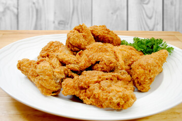 Fried Chicken Pieces on a White Platter