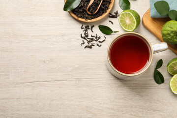 Flat lay composition with cup of tasty bergamot tea on white wooden table, space for text - obrazy, fototapety, plakaty
