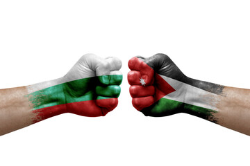 Two hands punch to each others on white background. Country flags painted fists, conflict crisis concept between bulgaria and jordan