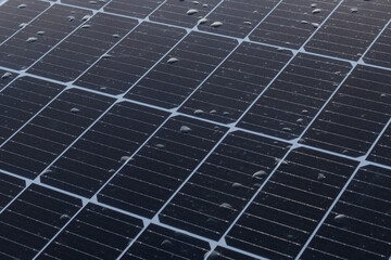 Drops of rain on a solar panel. Rain on the solar panel.