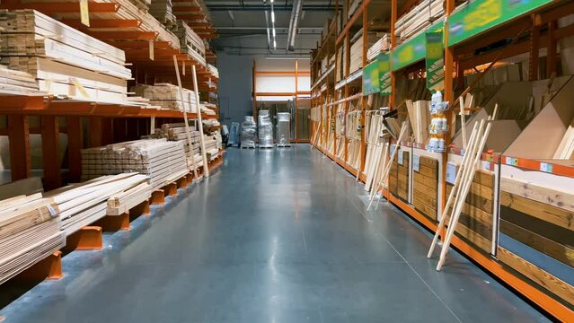 Home depot interior with wooden goods on shelves. Hardware store interior. Warehouse-shop of wooden parts