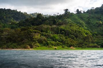 Fototapeta na wymiar Mountain views from a boat on a lake in Costa Rica. 