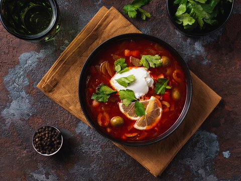Traditional Russian soup solyanka closeup in a bowl on the table