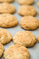 Freshly baked coconuts on baking paper.
