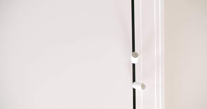 Minimalist suspended ceiling and plasterboard construction in decorating the apartment or house with modern white lamps. video with dolly. Modern Ceiling with Lamp. Minimalist Interior