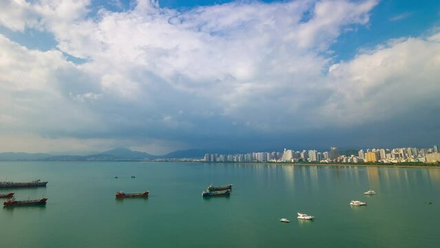 sanya cityscape bay sunny day famous hotel resort rooftop panorama timelapse 4k hainan island china