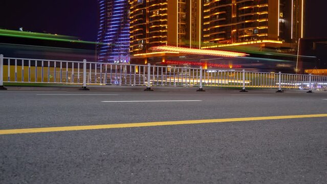 night time illuminated sanya traffic street apartment complex panorama 4k hainan island china