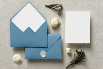 Wedding invitation card mockup and wedding envelopes with seashells. Sea, nautical style wedding...