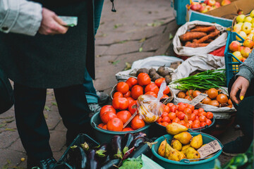 Tomatoes and other vegetables selling outdoor on the street. Giving money. Dirt. Legal. Pirate. Fruit. Place. Centre. Crime. Farm. Poor. Raw. Local. Trade. Price. Open. Food. Red. Sell. City. Health