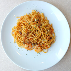 Delicious pasta spaghetti with shrimps in white plate