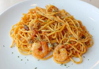 Delicious pasta spaghetti with shrimps in white plate