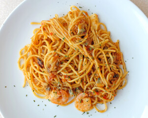 Delicious pasta spaghetti with shrimps in white plate