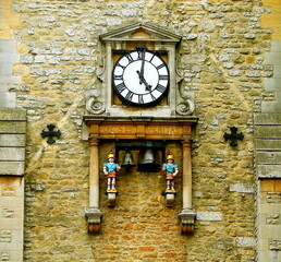 Carfax tower clock, Oxford. Close up of the clock and the quarterboys on Carfax Tower where is written the Latin phrase: "FORTIS EST VERITAS” that is: "The truth is strong", Oxfordshire, England, UK