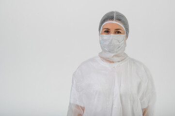 Doctor or nurse in a medical gown, mask and protective gloves