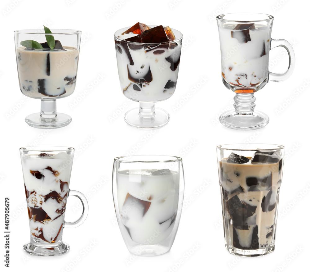 Wall mural glasses of milk with tasty grass jelly on white background