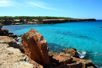 view from the top of an arid cliff on the bluest and crystalline sea of ​​the Balearic islands