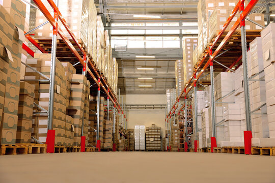 Worker in warehouse, low angle view. Wholesale business