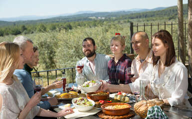Friends having lunch on the open-air terrace. High quality photo