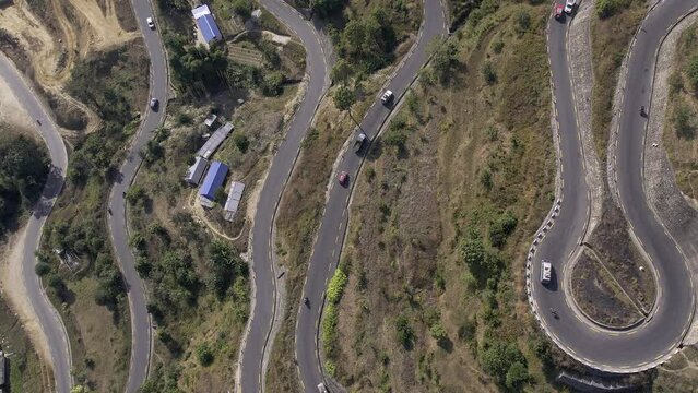 Looking down at the Banepa Bardibas Highway from aerial view in Nepal moving over the road as traffic flows.