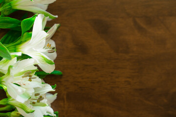 Fototapeta na wymiar bouquet of flowers on a wooden background