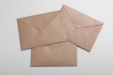 Brown paper envelopes on light grey background, flat lay