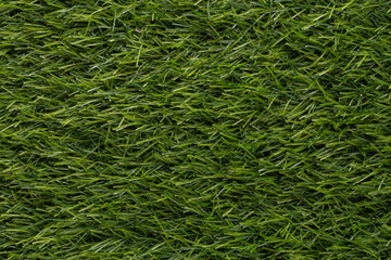 Green artificial grass textures for backgrounds and wallpaper. Texture background. Abstract background. Macro photography. Close up