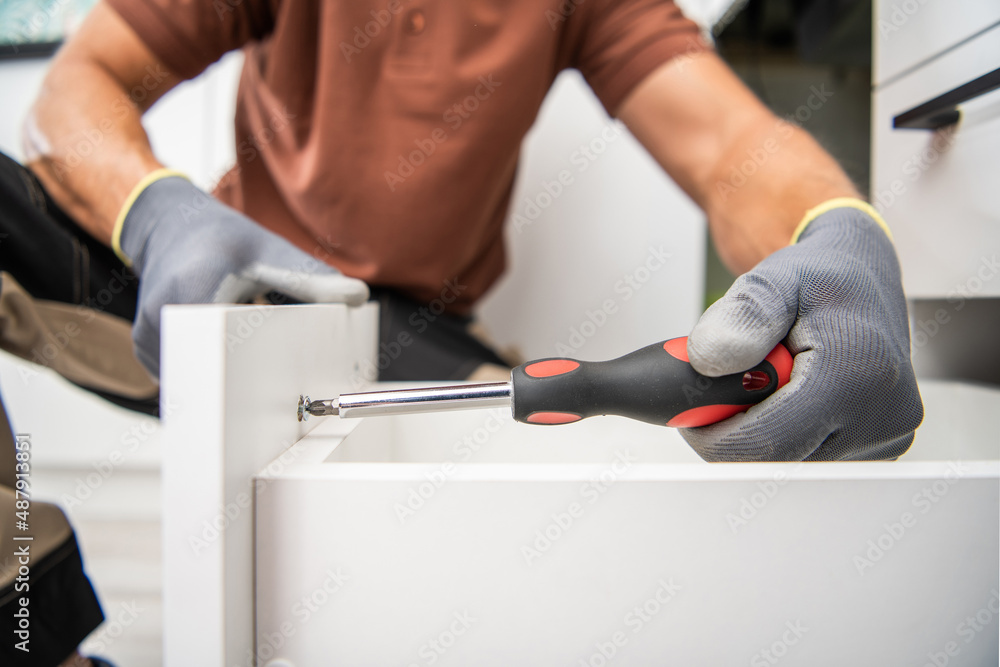 Wall mural Men Assembling Kitchen Cabinets