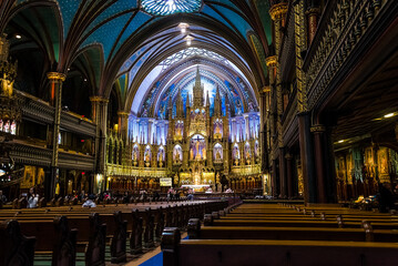 Fototapeta premium Architectural detail of Notre-Dame Basilica, a basilica in the historic district of Old Montreal. Its dramatic interior is considered a masterpiece of Gothic Revival architecture