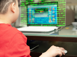 child is typing keyboard computer for internet education technology and learning