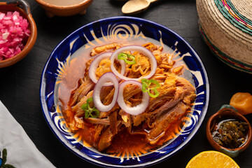 Cochinita pibil with habanero pepper and purple onion. Mexican food