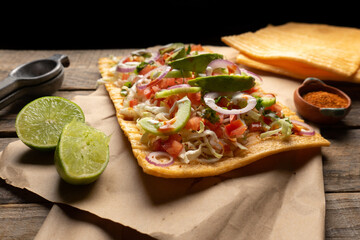Snack made with wheat flour called chicharron preparado with sauce and vegetables. Mexican food