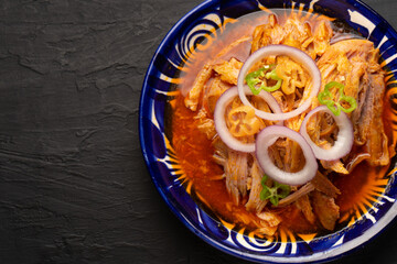 Cochinita pibil with habanero pepper and purple onion. Mexican food