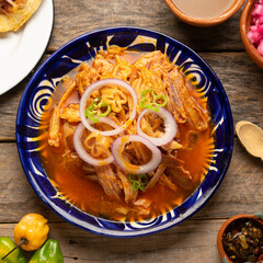 Cochinita pibil with habanero pepper and purple onion. Mexican food