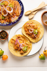 Cochinita pibil tacos with habanero pepper and purple onion. Mexican food