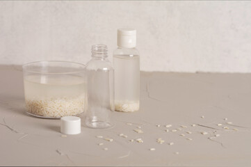 Jar of rice water for skin care face cleansing cosmetic product. Holistic beauty concept, fermented beauty care trend. Copy space