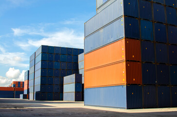 Fototapeta premium Industrial Containers in a Cargo freight ship,Container Cargo freight ship by crane bridge, logistics harbor at sunrise