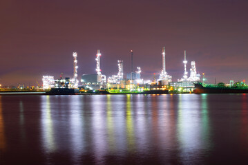 Oil refinery industry at sunset - factory - petrochemical plant