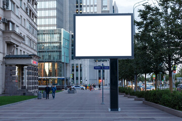 Billboard empty on the background of office buildings in the city. Mock-up.