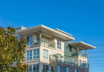 Brand new apartment building on sunny day in BC, Canada. Architectural details of modern apartment building