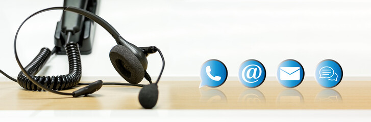 Headset and contact icon at call center.  Corporate business help desk and telephone assistance concept .