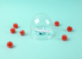 Minimalistic still life. Air plane under the Dome protecting from virus strain molecules