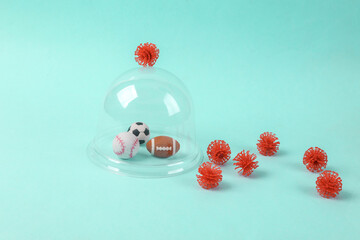Minimalistic still life. Sports balls under the Dome protecting from virus strain molecules