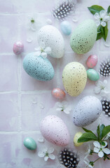 Fototapeta na wymiar Colorful Easter eggs on tile background