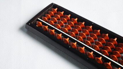 Naklejka premium Brown abacus on white background.
